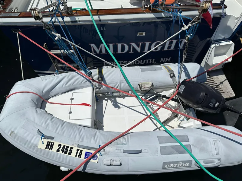 Slide: The Image of Inflatable dinghy tied to a 2001 Sabre Sabreline 43 yacht in Portsmouth, NH marina. - 12
