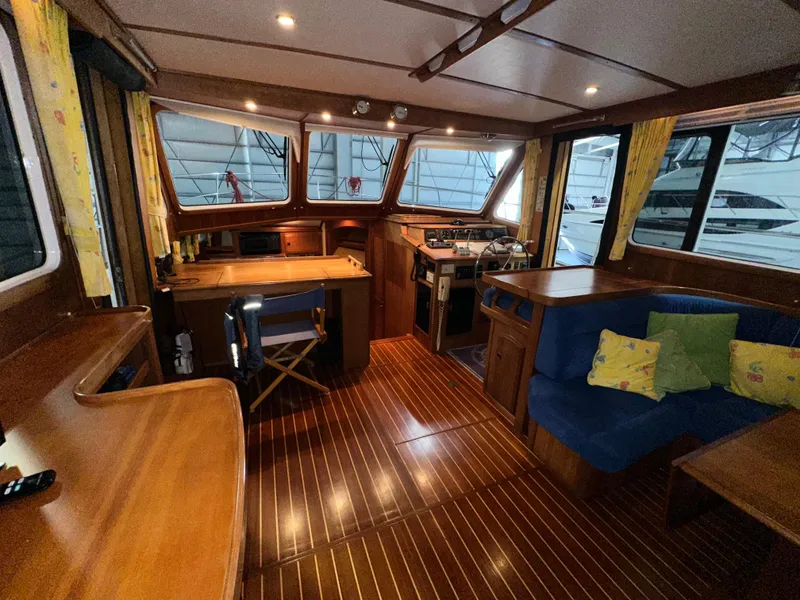 Slide: The Image of Interior of 2001 Sabre Sabreline 43 yacht with wooden flooring and cozy seating area. - 16
