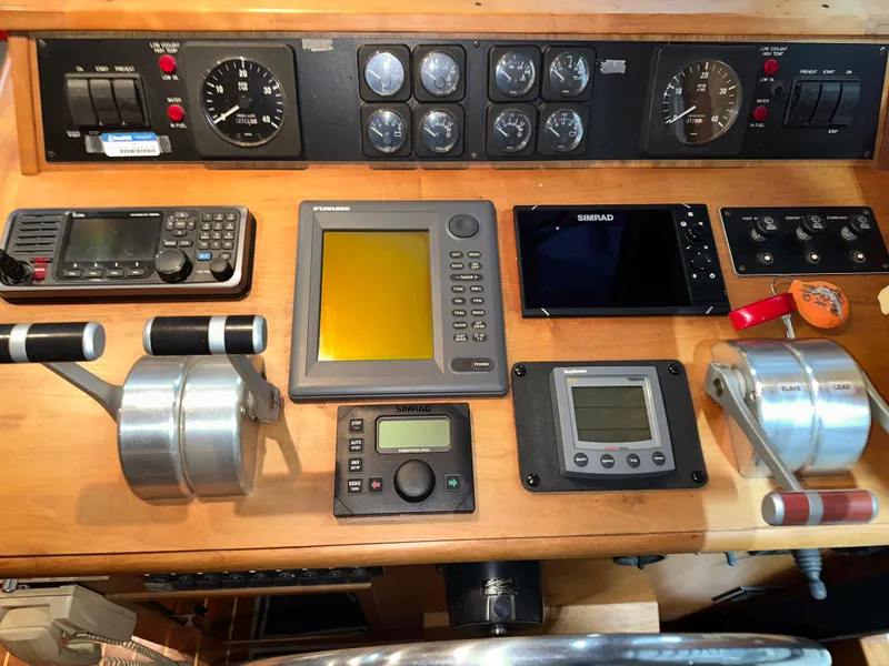 Slide: The Image of Control panel of a 2001 Sabre Sabreline 43 boat with navigation instruments and gauges. - 19