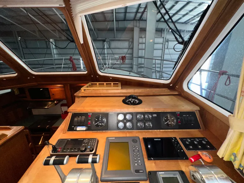 Slide: The Image of Interior view of 2001 Sabreline 43 yacht cockpit with navigation instruments. - 20