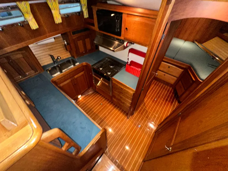 Slide: The Image of Interior of 2001 Sabreline 43 yacht with wood finish and modern kitchen amenities. - 24