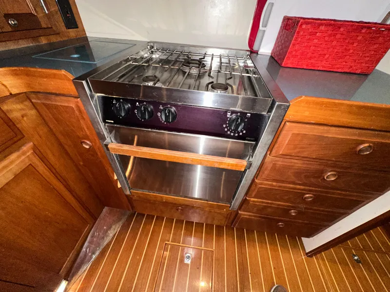 Slide: The Image of Wooden yacht kitchen with stainless steel stove, Sabreline 43, 2001 model. - 29