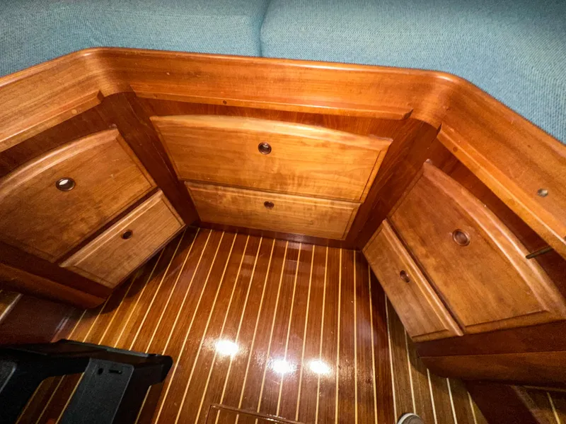 Slide: The Image of Wooden cabinetry and flooring inside a 2001 Sabre Sabreline 43 boat interior. - 32