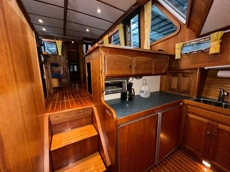 Slide: The Image of Interior of 2001 Sabre Sabreline 43 yacht with wooden cabinetry and modern appliances. - 36