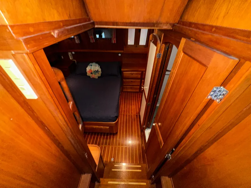 Slide: The Image of Interior cabin of 2001 Sabreline 43 yacht with wooden finish and bed. - 37