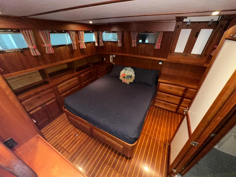 Slide: The Image of Luxurious wooden cabin interior of 2001 Sabre Sabreline 43 yacht with bed and storage. - 38