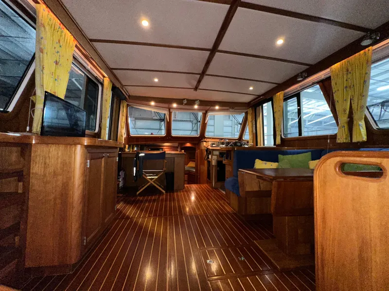 Slide: The Image of Interior of 2001 Sabre Sabreline 43 yacht with wood finish and cozy seating area. - 47