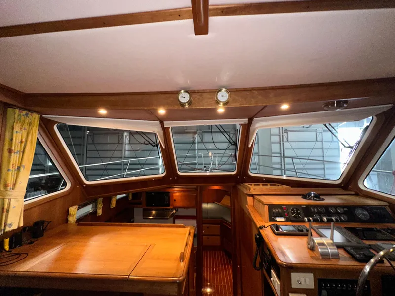 Slide: The Image of Interior of 2001 Sabre Sabreline 43 yacht with wooden finishes and navigation controls. - 49