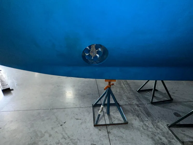 Slide: The Image of Bottom view of a 2001 Sabreline 43 boat hull on stands in a workshop. - 7