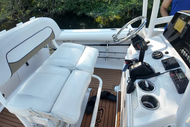Slide: The Image of 2015 Sportsman Heritage 231 Center Console interior with steering wheel and seating. - 21