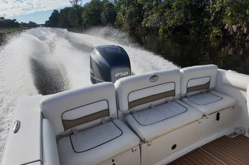 Slide: The Image of 2015 Sportsman Heritage 231 Center Console boat cruising on a scenic waterway. - 25
