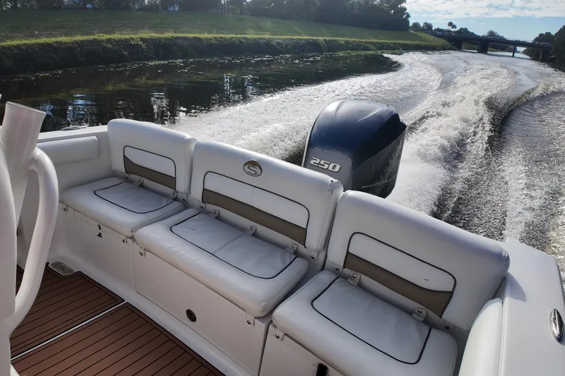 Slide: The Image of 2015 Sportsman Heritage 231 Center Console boat cruising on a river. - 26