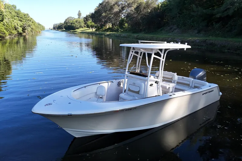 Slide: The Image of 2015 Sportsman Heritage 231 Center Console boat on a serene river. - 7