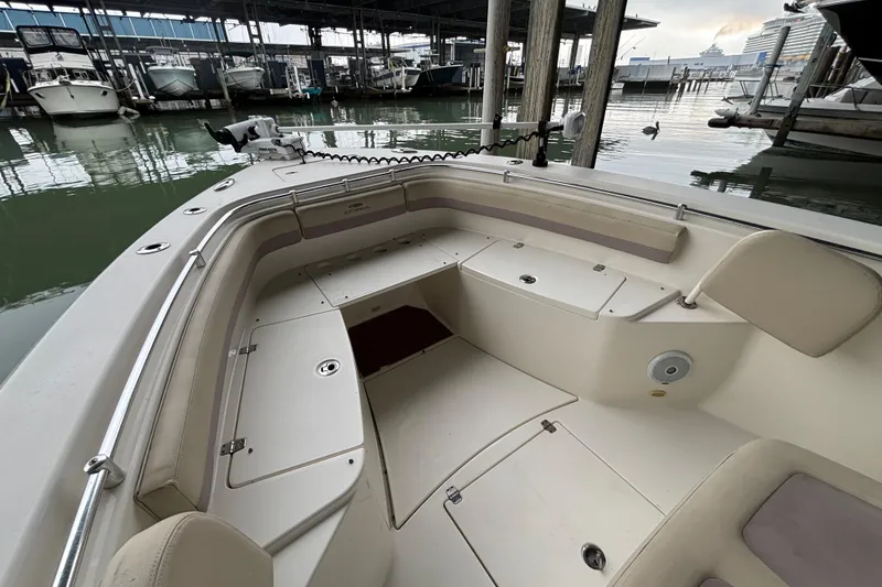 Slide: The Image of 2017 Cobia 296 Center Console boat interior at marina dock. - 23