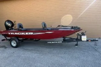 The Image of 2025 Tracker Panfish 17 boat, red, on trailer, side view. - 0