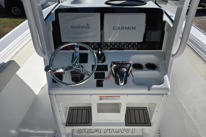 Slide: The Image of 2026 Sea Hunt Ultra 275 SE boat dashboard with Garmin navigation systems. - 11