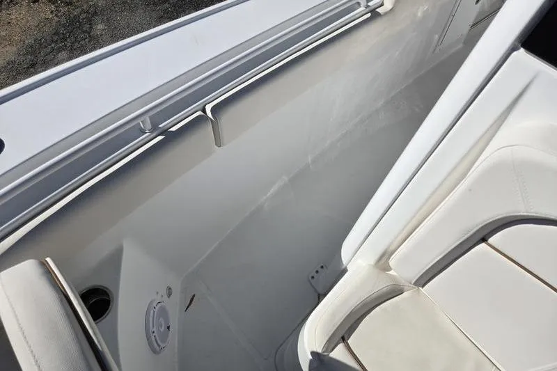 Slide: The Image of 2026 Sea Hunt Ultra 275 SE boat interior with white seating and sleek design. - 16