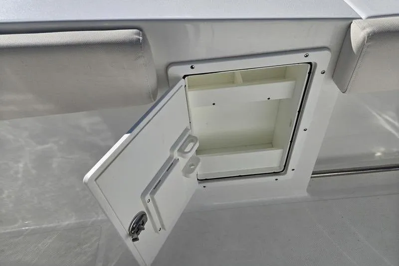 Slide: The Image of Open storage compartment on 2026 Sea Hunt Ultra 275 SE boat. - 19
