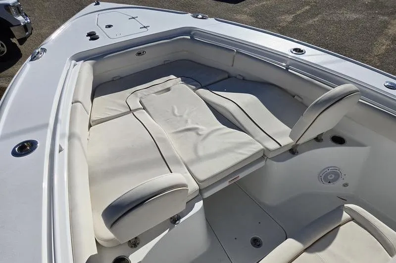 Slide: The Image of 2026 Sea Hunt Ultra 275 SE boat with spacious, cushioned seating area. - 2