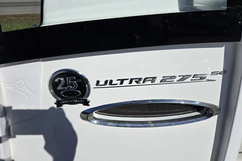 Slide: The Image of 2026 Sea Hunt Ultra 275 SE 25th Anniversary emblem on white surface. - 20