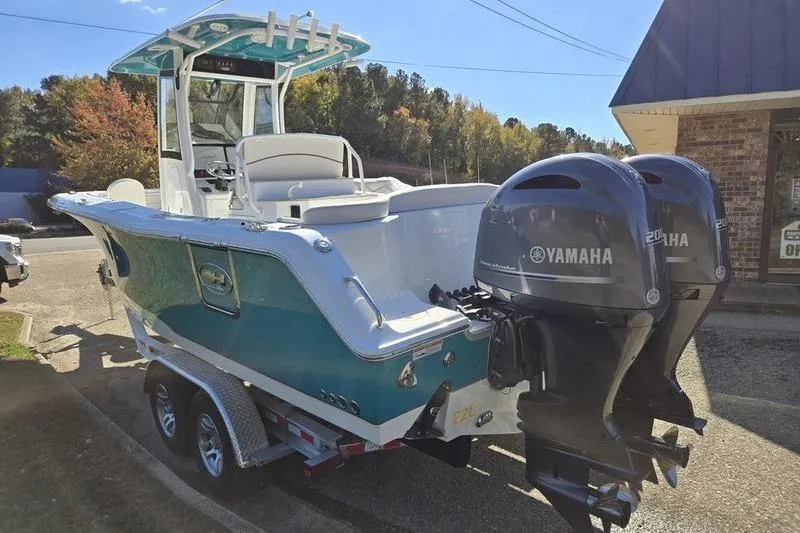Slide: The Image of 2026 Sea Hunt Ultra 275 SE boat with dual Yamaha engines on a trailer. - 3
