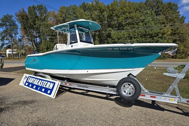 Slide: The Image of 2026 Sea Hunt Ultra 275 SE boat on trailer at Southeastern Marine dealership. - 5