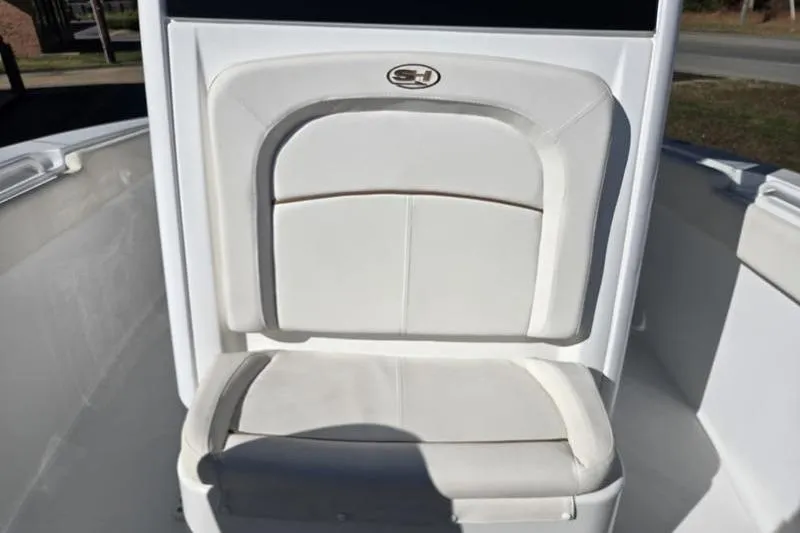 Slide: The Image of 2026 Sea Hunt Ultra 275 SE boat seat with logo, featuring white cushioned design. - 8
