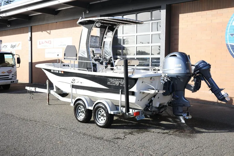 Slide: The Image of 2013 Carolina Skiff 178 DLV boat on trailer with Yamaha outboard motor. - 3