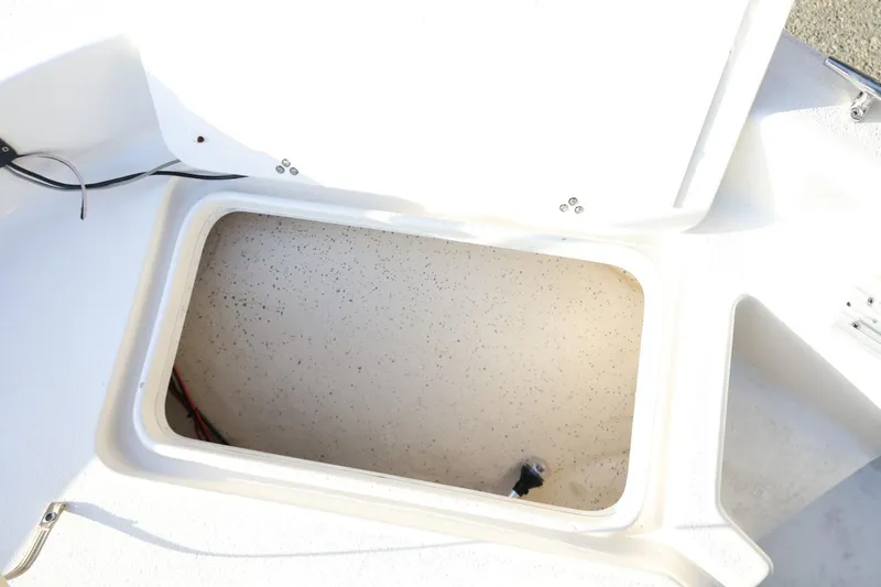 Slide: The Image of Open storage compartment on a 2013 Carolina Skiff 178 DLV boat. - 31
