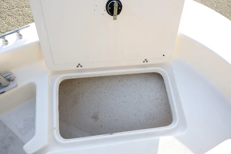 Slide: The Image of Open storage compartment on a 2013 Carolina Skiff 178 DLV boat. - 32