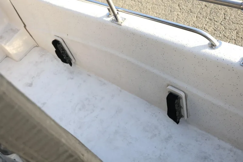 Slide: The Image of Interior view of a 2013 Carolina Skiff 178 DLV boat, featuring a speckled white deck. - 35