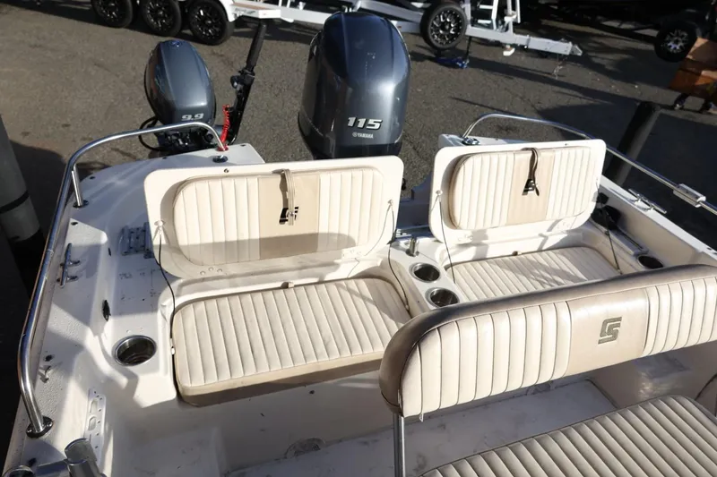 Slide: The Image of 2013 Carolina Skiff 178 DLV boat interior with seating and Yamaha outboard motors. - 38