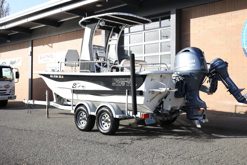 Slide: The Image of 2013 Carolina Skiff 178 DLV boat on trailer with Yamaha outboard motor. - 4