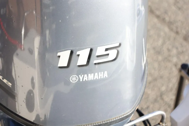 Slide: The Image of Yamaha 115 outboard motor on a 2013 Carolina Skiff 178 DLV boat. - 41