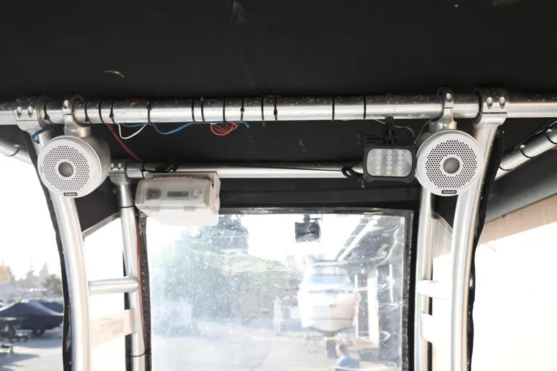 Slide: The Image of 2013 Carolina Skiff 178 DLV boat interior with speakers and lighting setup. - 42