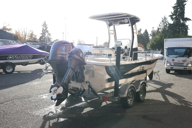Slide: The Image of 2013 Carolina Skiff 178 DLV boat on trailer with Yamaha outboard motor. - 7