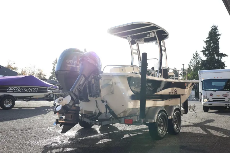 Slide: The Image of 2013 Carolina Skiff 178 DLV boat on trailer with Yamaha outboard motor. - 8