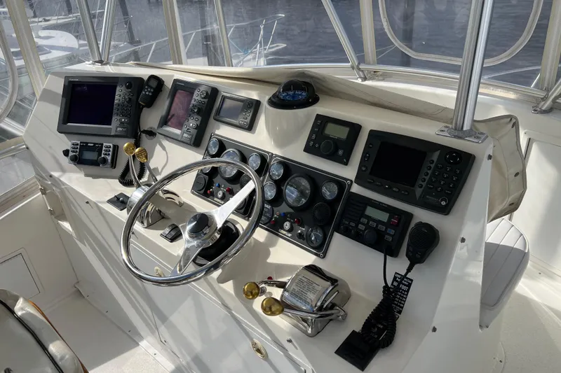 Slide: The Image of Helm of 2004 Henriques 35 Sportfisherman with navigation instruments and steering wheel. - 112