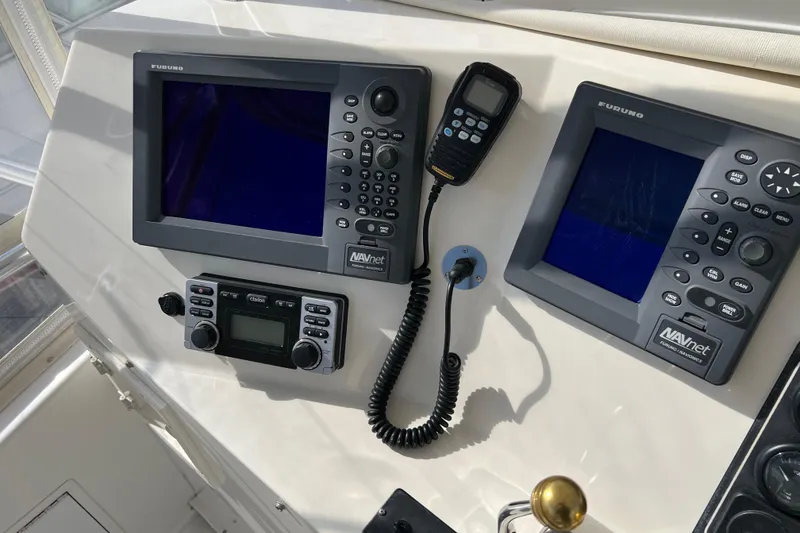 Slide: The Image of Control panel of a 2004 Henriques 35 Sportfisherman with Furuno navigation equipment. - 113