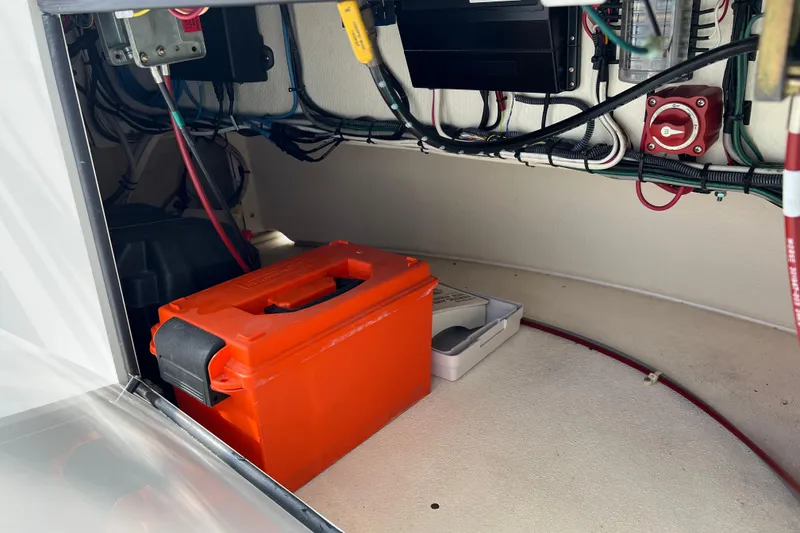 Slide: The Image of Electrical compartment of a 2004 Henriques 35 Sportfisherman with wiring and orange battery box. - 117