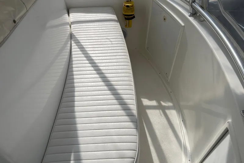Slide: The Image of White seating area on a 2004 Henriques 35 Sportfisherman boat, showcasing sleek design. - 121
