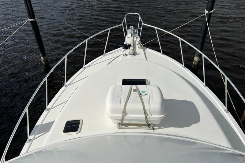 Slide: The Image of Bow view of 2004 Henriques 35 Sportfisherman, featuring deck and railing details. - 122