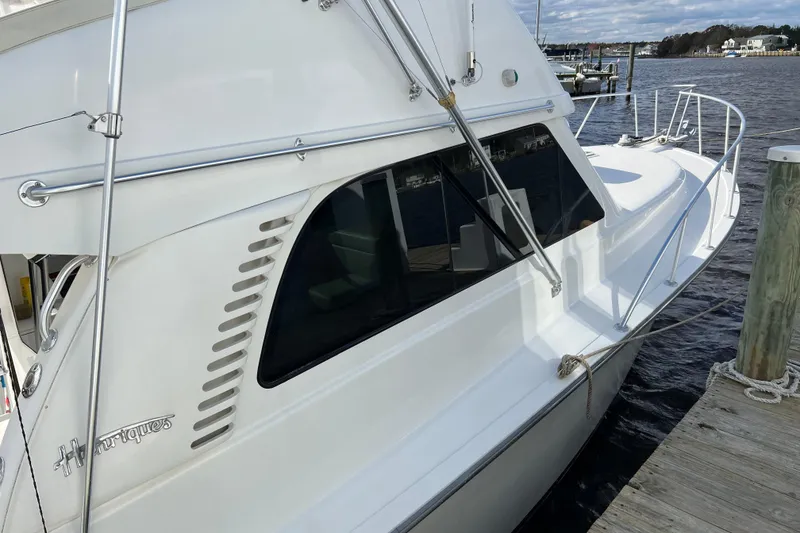 Slide: The Image of 2004 Henriques 35 Sportfisherman docked, showcasing sleek design and sturdy build. - 124