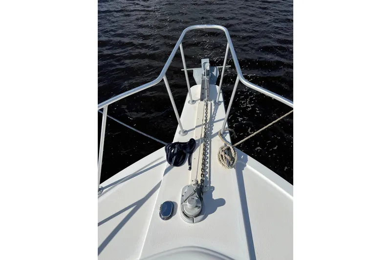 Slide: The Image of Bow of 2004 Henriques 35 Sportfisherman with anchor chain and calm water view. - 126