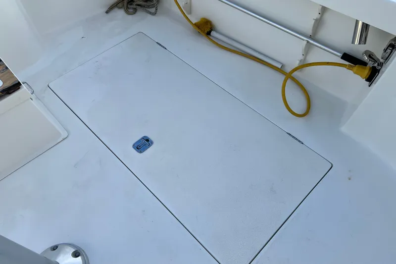 Slide: The Image of Deck of 2004 Henriques 35 Sportfisherman with hatch and yellow power cord. - 23