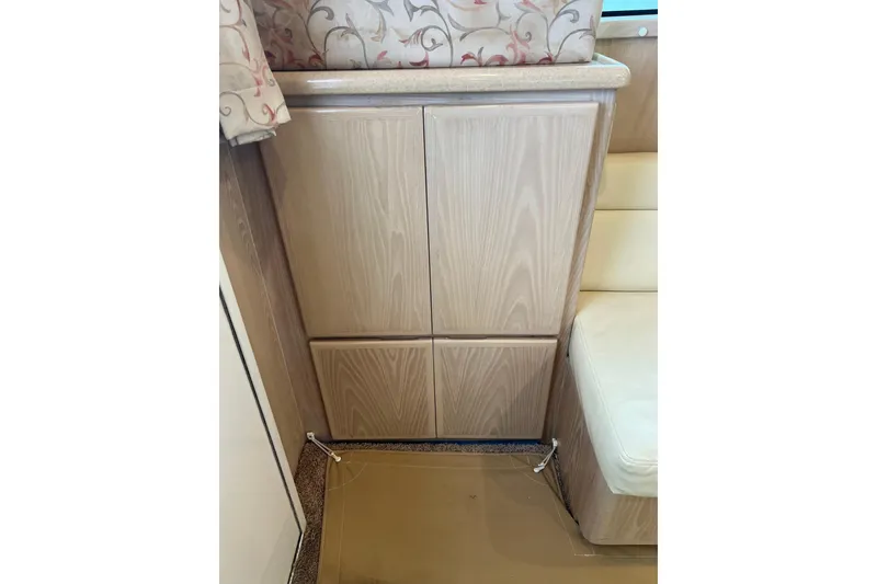 Slide: The Image of Interior of 2004 Henriques 35 Sportfisherman with wood cabinetry and floral curtains. - 40