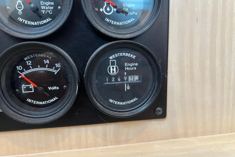 Slide: The Image of Close-up of engine gauges on a 2004 Henriques 35 Sportfisherman boat. - 42