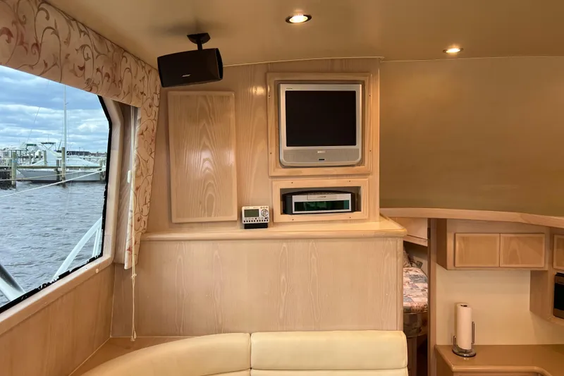 Slide: The Image of Interior of 2004 Henriques 35 Sportfisherman with TV, speaker, and window view. - 45