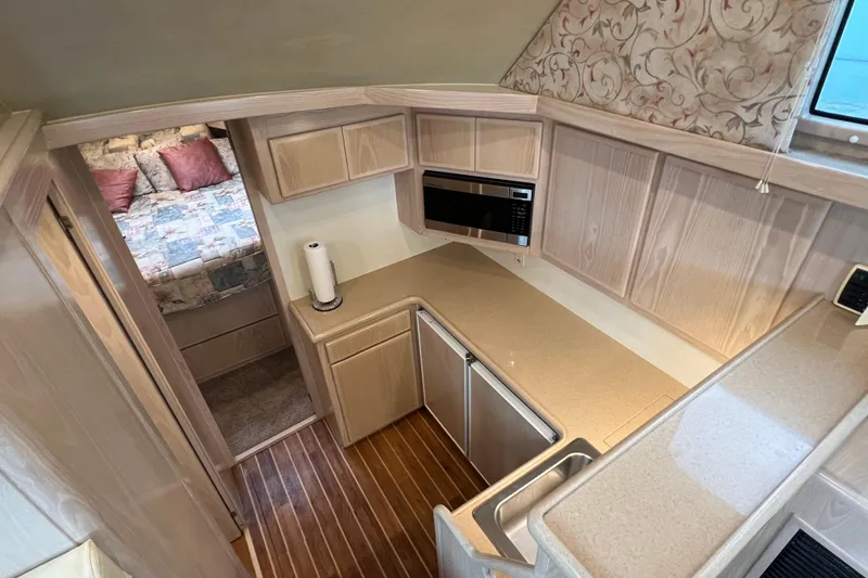 Slide: The Image of Interior of 2004 Henriques 35 Sportfisherman with kitchen and cozy bedroom. - 51