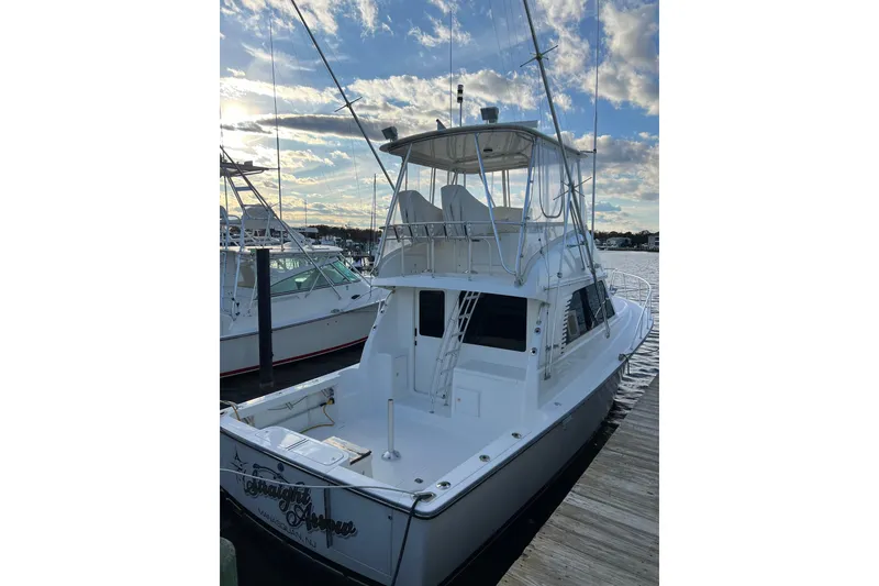 Slide: The Image of 2004 Henriques 35 Sportfisherman docked, showcasing sleek design and fishing capabilities. - 6